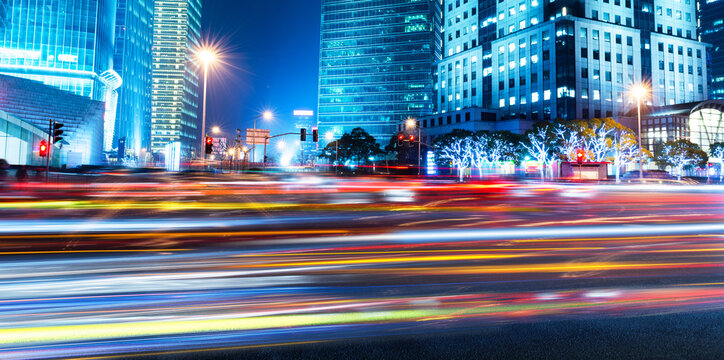 Moving car with blur light through modern city