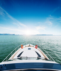 Luxury yacht  moving along the coast