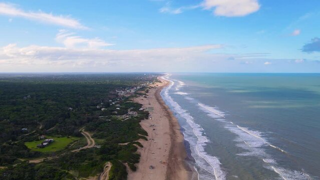 Drone shot flying along the beach in Caril&oacute;, Argentina.