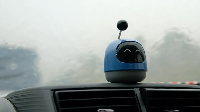 Plastic Figure Toy On Car Dashboard