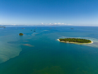 Fototapeta na wymiar Aerial view of tropical island with white sandy beach. Mindanao, Philippines.