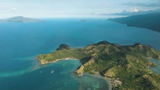Beautiful azure water and corals in coastal of sleeping dinasaur island in Mati. Mindanao, Philippines. Seascape. Travel concept.