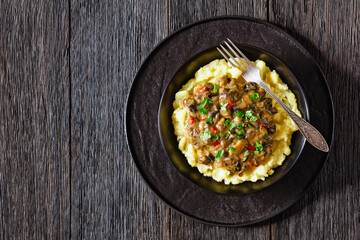 potato mash topped with mushroom gravy in bowl
