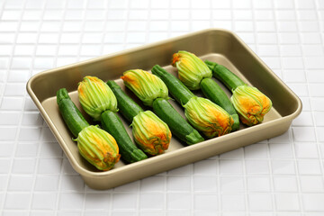 zucchini flowers in a tray