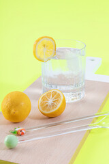 A Vibrant Composition Of Lemon And Ice Water On A Wooden Canvas