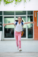 Little kid girl asian with a backpack going to school with fun. which increases the development and enhances the learning skills. Concept Back to school.