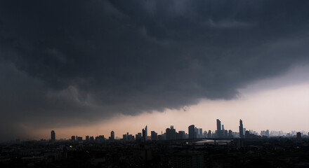 Panoramic view rainy season weather The sky was overcast with rain clouds and storms of the city skyline of the city's business district  Strong winds and lightning weather concept