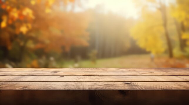 Wooden table space with autumn blur backround