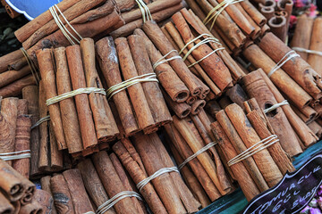 Cinnamon sticks at Egypt bazaar spice store, Istanbul, Turkey. Oriental cooking and seasoning concept. Selected focus, spices background