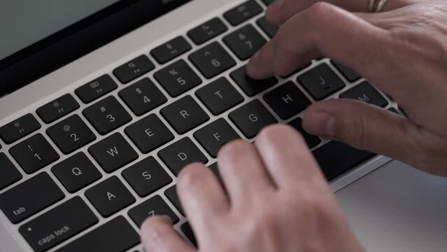 businessman hands type on laptop 