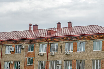 Fragment of the facade of an old office building on a summer day