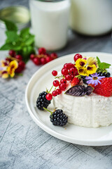 goat cheese with fresh berries and flowers