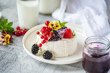 goat cheese with fresh berries and flowers