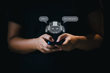 Hand using smartphone chatting with chatbot. Artificial Intelligence technology respond online messages to help customers. Futuristic technology, Virtual assistant on internet.