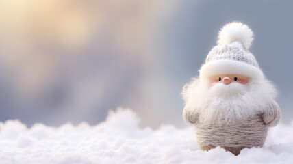 Obraz premium Adorable woolen Santa Claus on snowy winter background