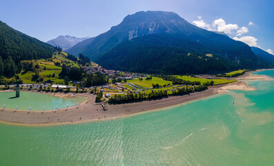 Lake Reschensee in Tirol with the sunken church tower