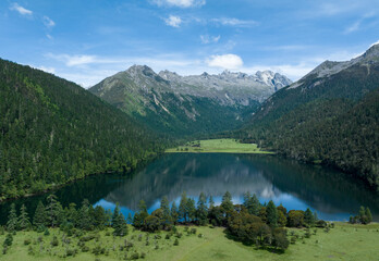 Fototapeta na wymiar Beautiful view of high altitude forest mountain and lake landscape in Sichuan,China