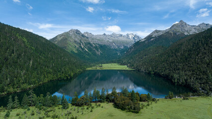Fototapeta na wymiar Beautiful view of high altitude forest mountain and lake landscape in Sichuan,China