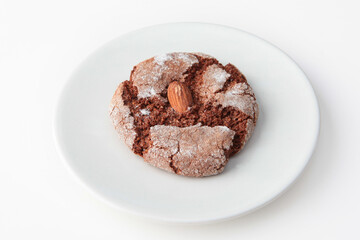 Macaroons on a white plate. Fresh pastries. Isolated object. Photo on a white background. He was lying face down.View from above.Place to copy.Vertical photo
