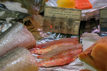 Filet of freshly caught striped red mullet fish priced at 89.8 EUR a kilo on display at a fish...
