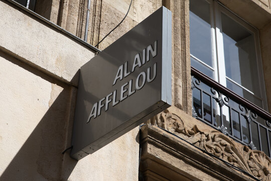 alain afflelou text sign and brand logo facade wall entrance of medic store chain french Optician medical glasses