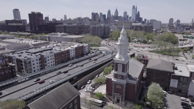 Drone Footage of Bustling Philadelphia Highway and St. Augustine Church - 4K Daytime Flying Shot
