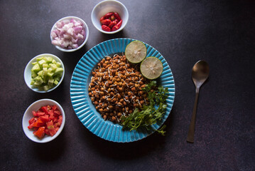 View from top of gram sprout salad served in a bowl. Selective focus.