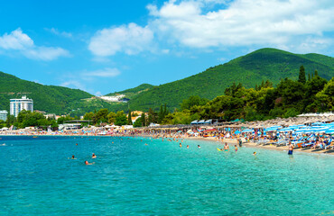 beautiful view of the seaside resort town and beaches, mountains, panorama of Budva in Montenegro, Adriatic Sea, tourism and summer travel