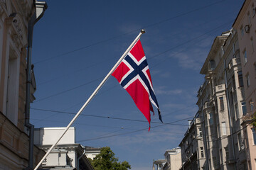 Norwegian national flag. Norge. Scandinavian cross. Norwegian flag on a flagpole. Norges flagg. Close up. Bottom up view.