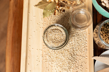 small jar with quinoa on rustic table top view. Healthy food and snack.