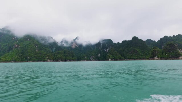 images from the boat on Khao Sok National Park, on a rainy day.