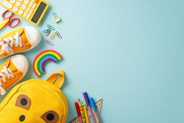 Captivate parents and educators with a striking top view photo of school bag brimming with vibrant...