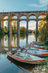 Railway Bridge with river in Bietigheim-Bissingen, Germany. Autumn. Railway viaduct over the Enz River, built in 1853 by Karl von Etzel on a sunny summer day. Bietigheim-Bissingen, Germany. Old