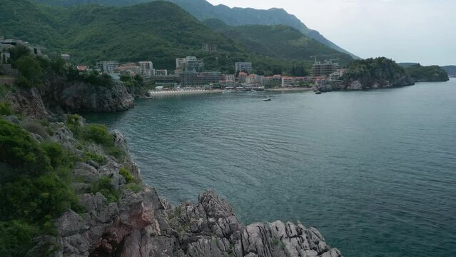 Przno city on the sea coast in Montenegro nearby Budva, aerial view. Summer day,