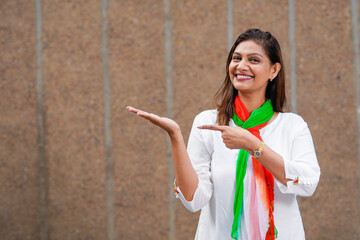 Indian woman in traditional wear and pointing empty hand or palm