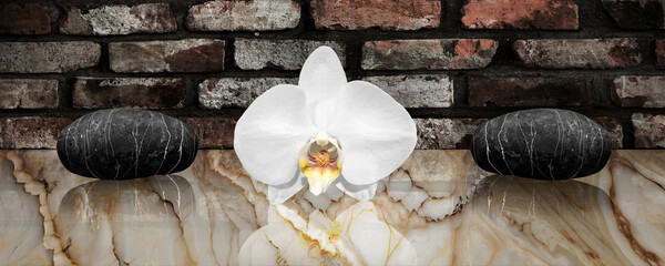 Orchid and zen stones on onyx marble tabletop with a vintage brick wall in the background