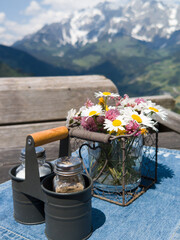 cruet stand with salt and pepper on an alpine pasture
