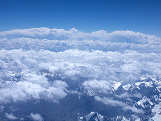 Fototapeta na wymiar sky and snow covered mountains