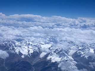 sky and snow covered mountains