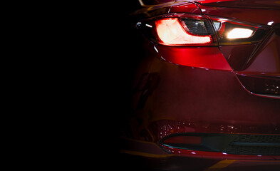 Expensive sports car concept. Modern luxury red cars, detail on one of the LED taillights modern...