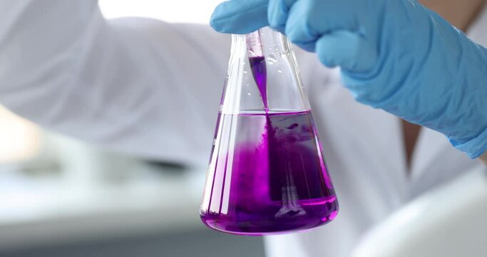 Scientist dripping reagent into water 4k movie. Checking the quality of alcohol concept
