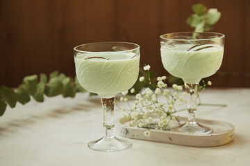 Aesthetic green healthy avocado cocktails. Low alcohol, zero proof drinks. Natural light.