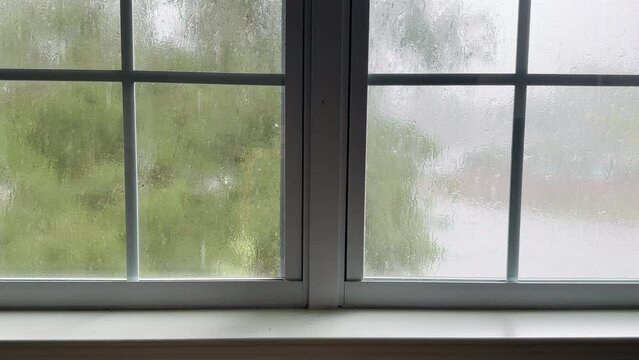 Looking through window during tropical storm
