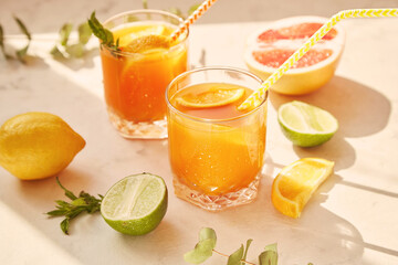 Summer cocktail with grapefruit and orange. Low alcohol, zero proof drinks concept. Trendy shadows...