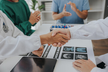 Doctor talking to colleague about vaccine in conference room at hospital