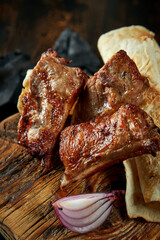 Pork shish kebab on wooden board. Turkish food. Pork grilled on a charcoal barbecue