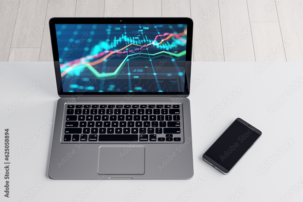 Poster close up and top view of laptop and cellphone with forex chart on screen at white office workplace. 