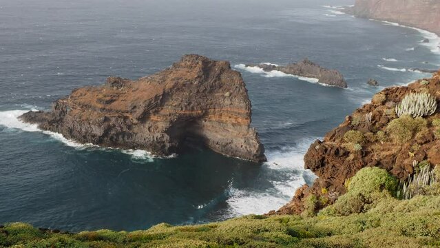 Coast of La Palma in the Canary Islands - Waves off the Atlantic Ocean hit the cliffs of volcanic coastline