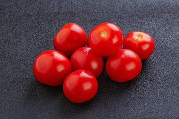 Ripe juicy cherry tomatoes heap