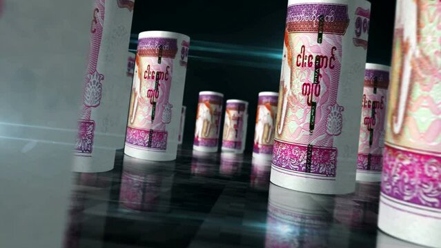 Myanmar money Burma Kyat rolls loop 3d animation. Money on the table. Seamless and loopable abstract concept of economy, finance, business and recession. Camera between MMK rolled banknotes.